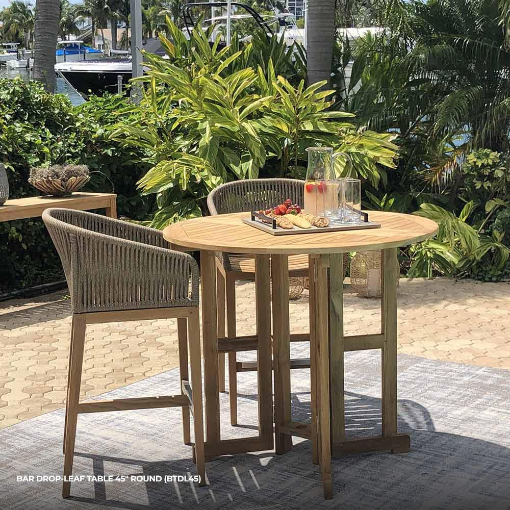 Round drop-leaf teak bar table with slatted top and sturdy turned legs