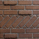 Brick firebox liner panel with aged brick pattern and reddish-brown texture