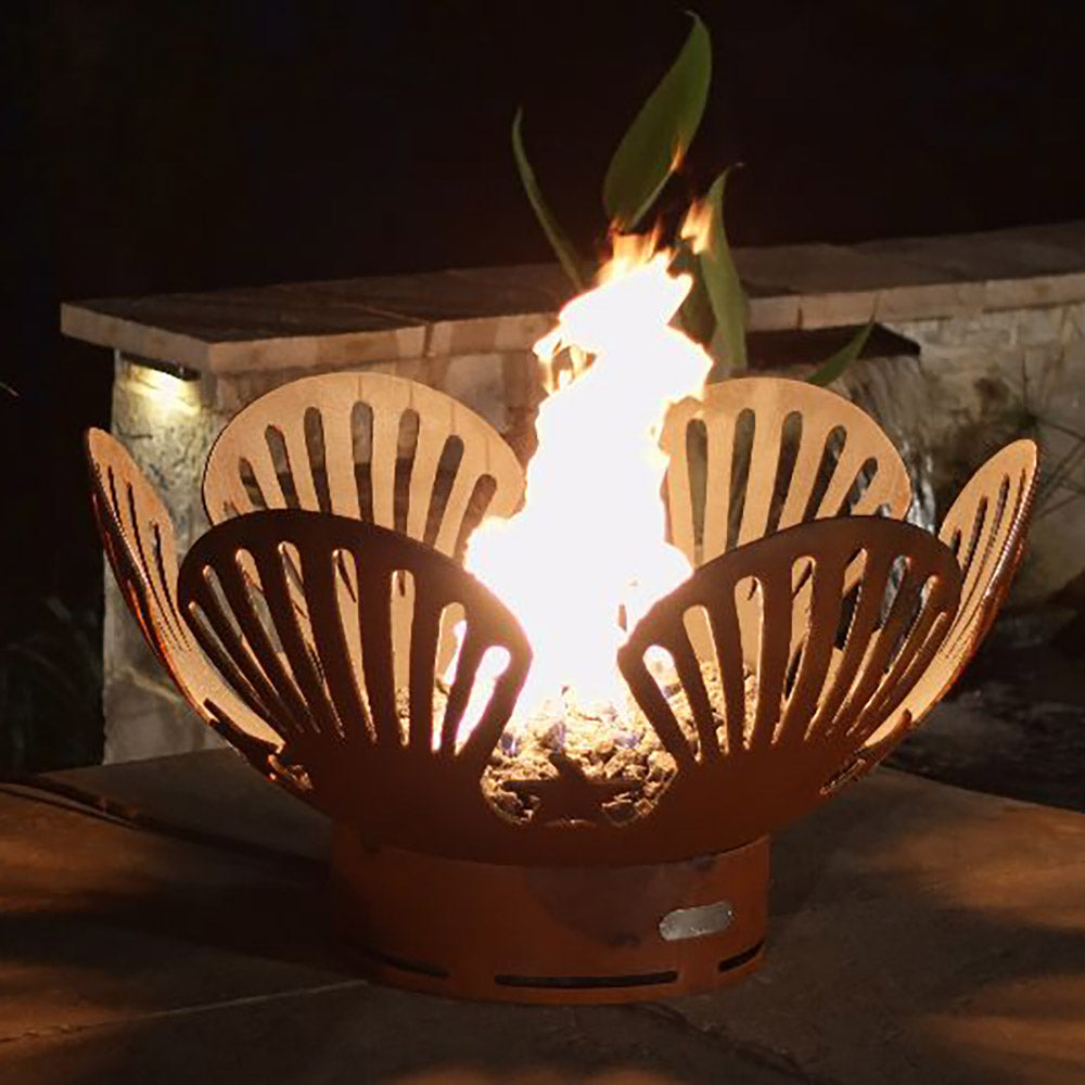 Gas fire pit with fan-shaped cutout screens and tall flames in the burner