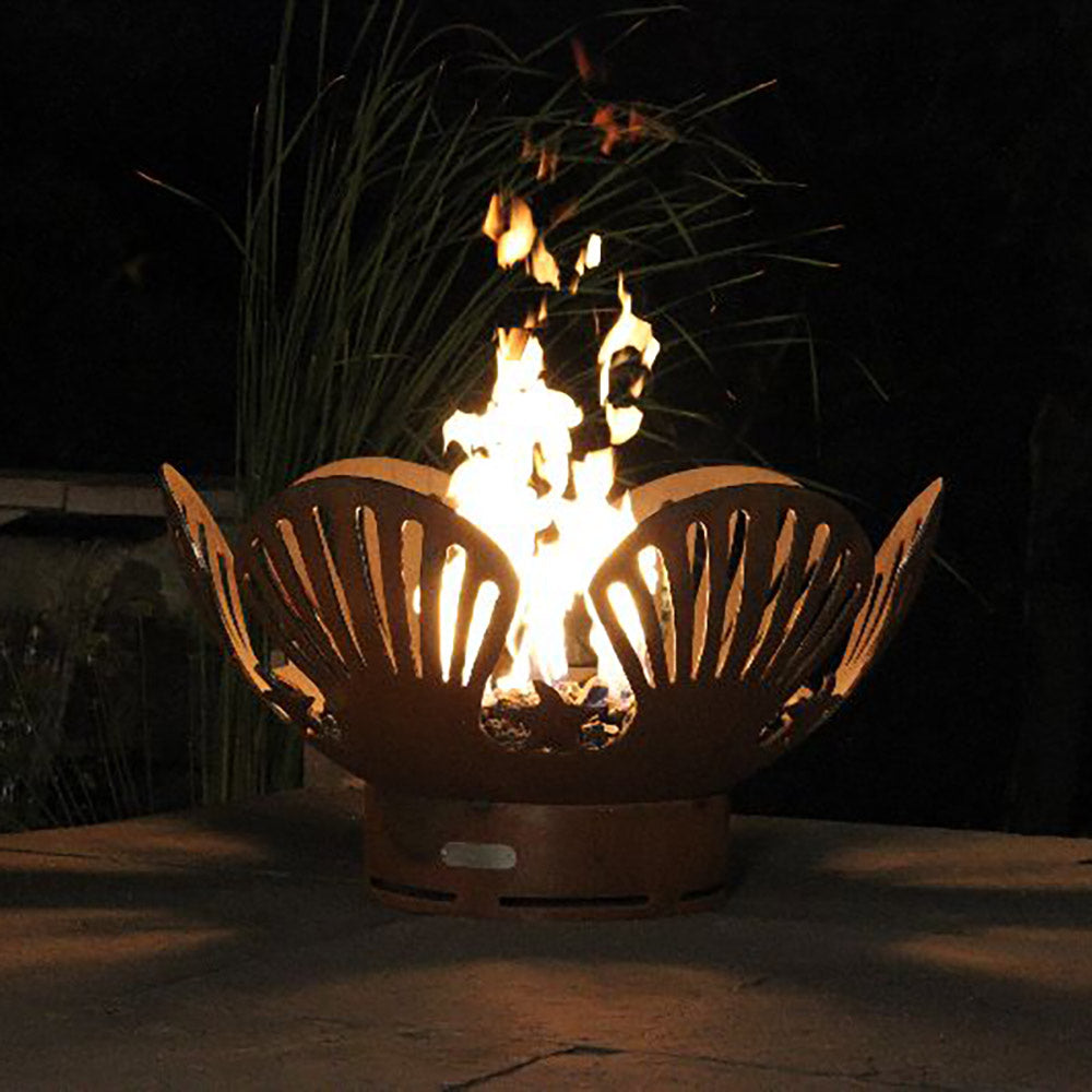 Gas fire pit with fan-shaped cutout screens and bright flames rising from the base