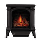 Black cast iron gas stove with arched firebox and flame viewing window