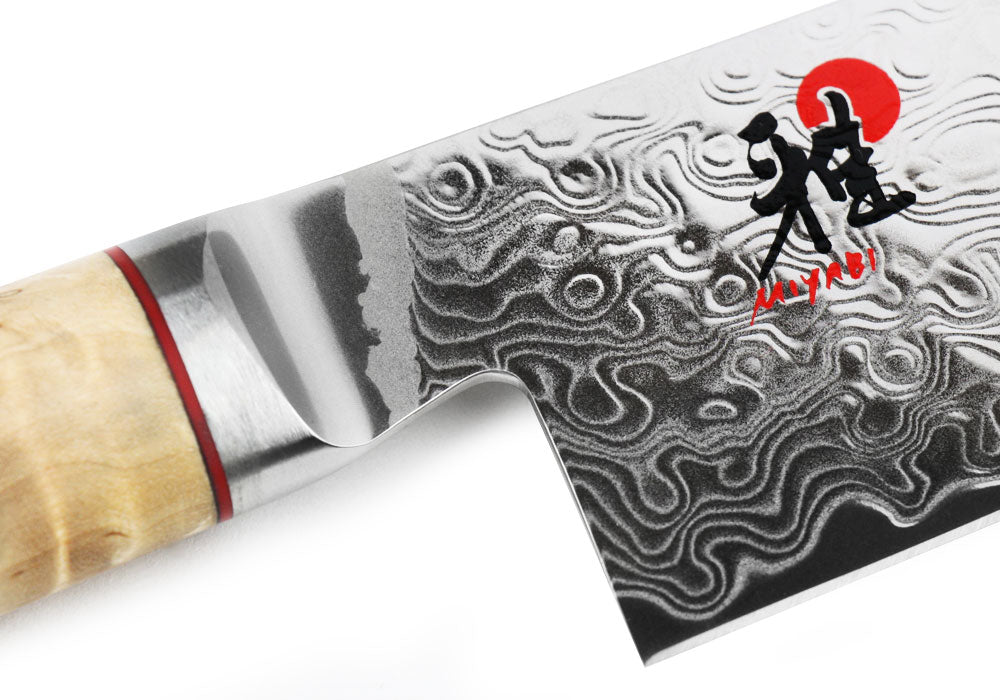 Damascus-style blade of Miyabi SG2 paring/utility knife with red logo