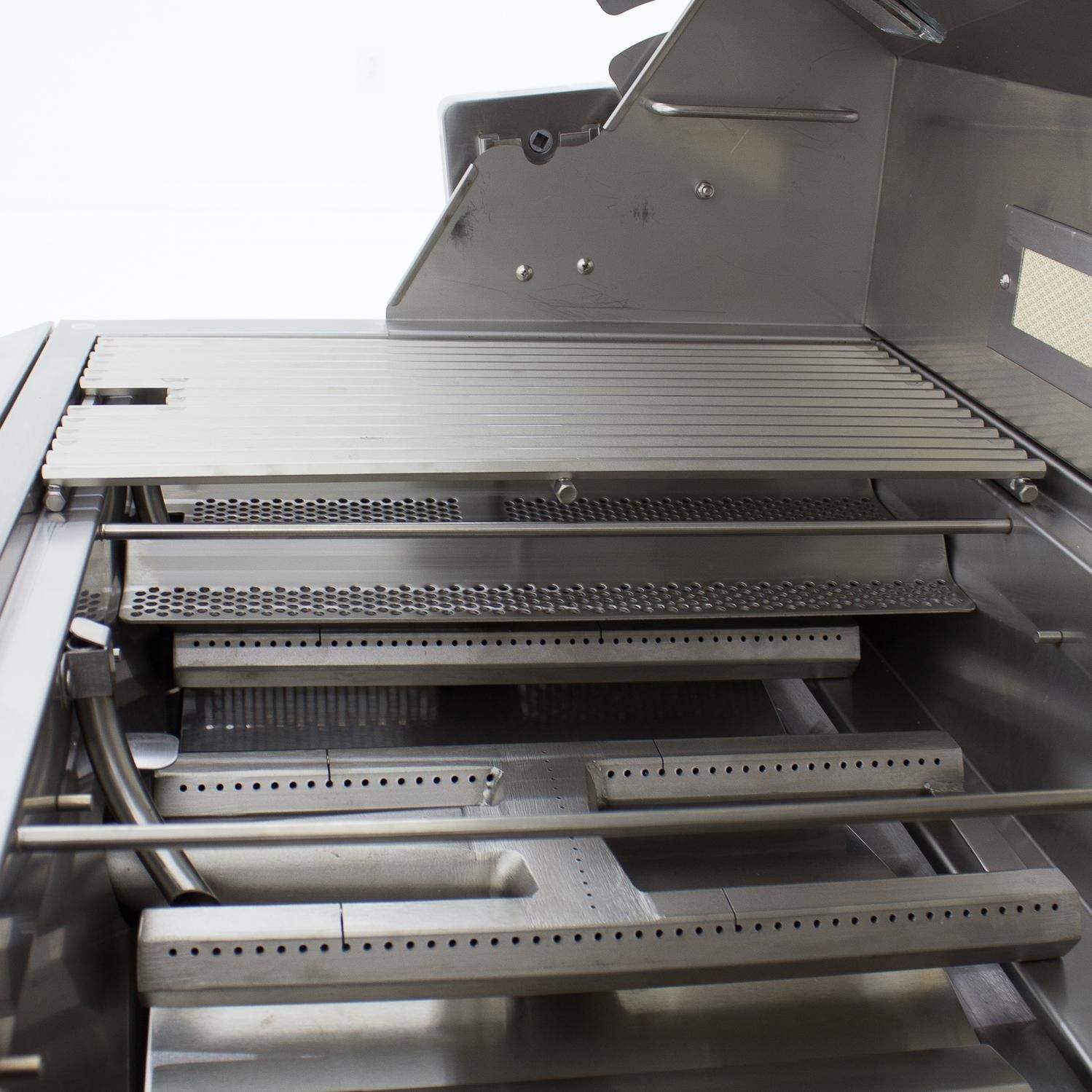 Gas grill cooking chamber with multiple burners and heat deflectors
