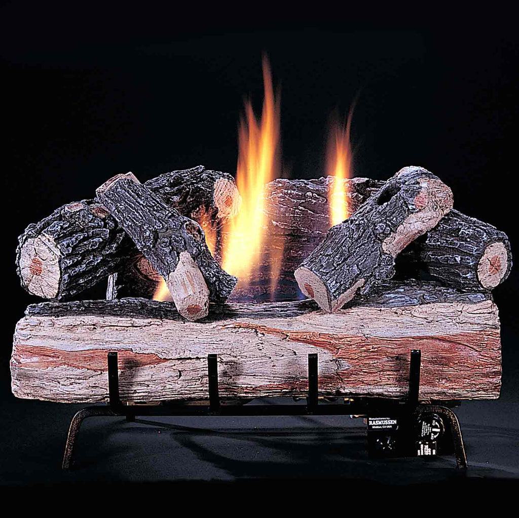 Ventless gas burner with burning wood logs, two flame jets over dark log bed