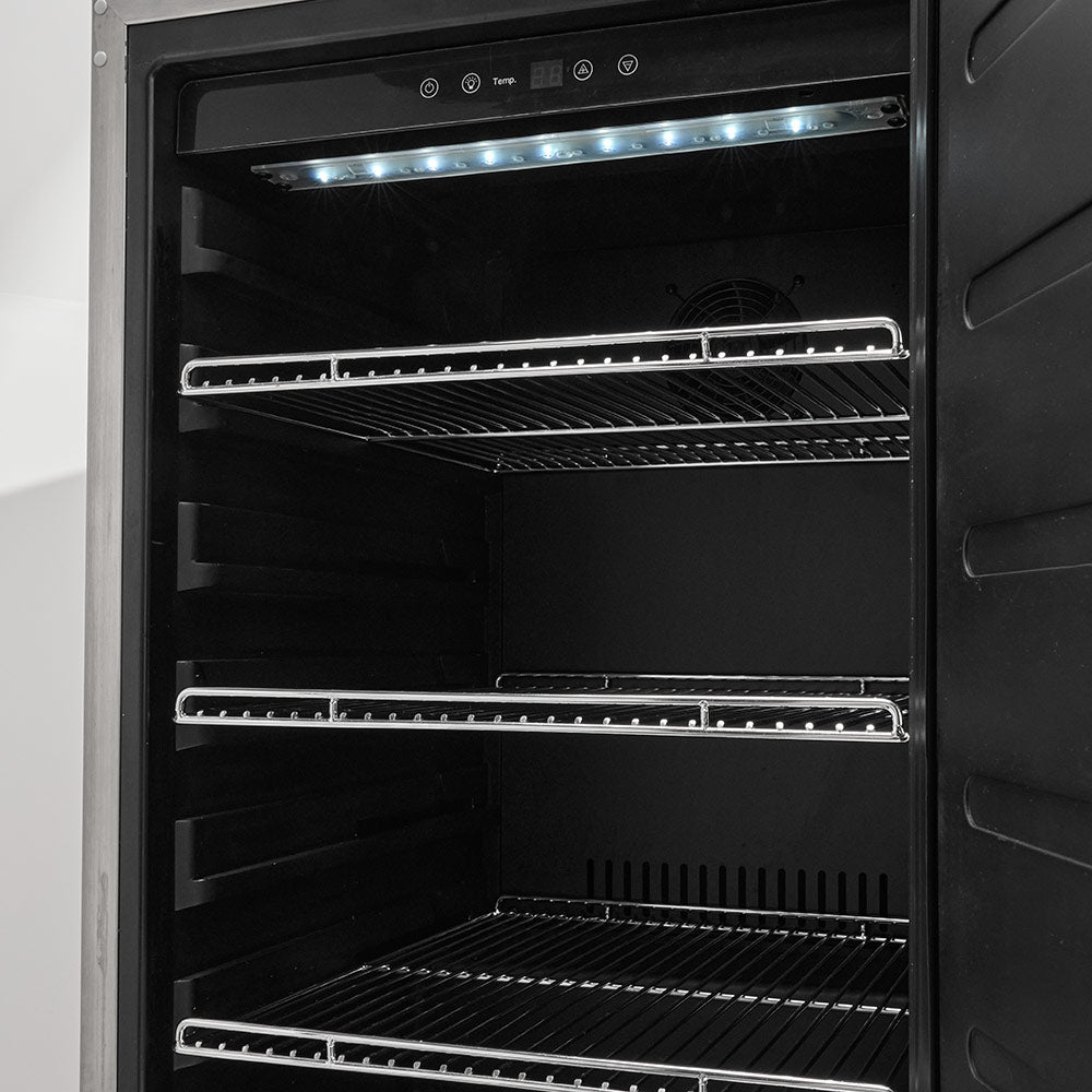 Refrigerator interior with wire shelves and overhead LED light strip