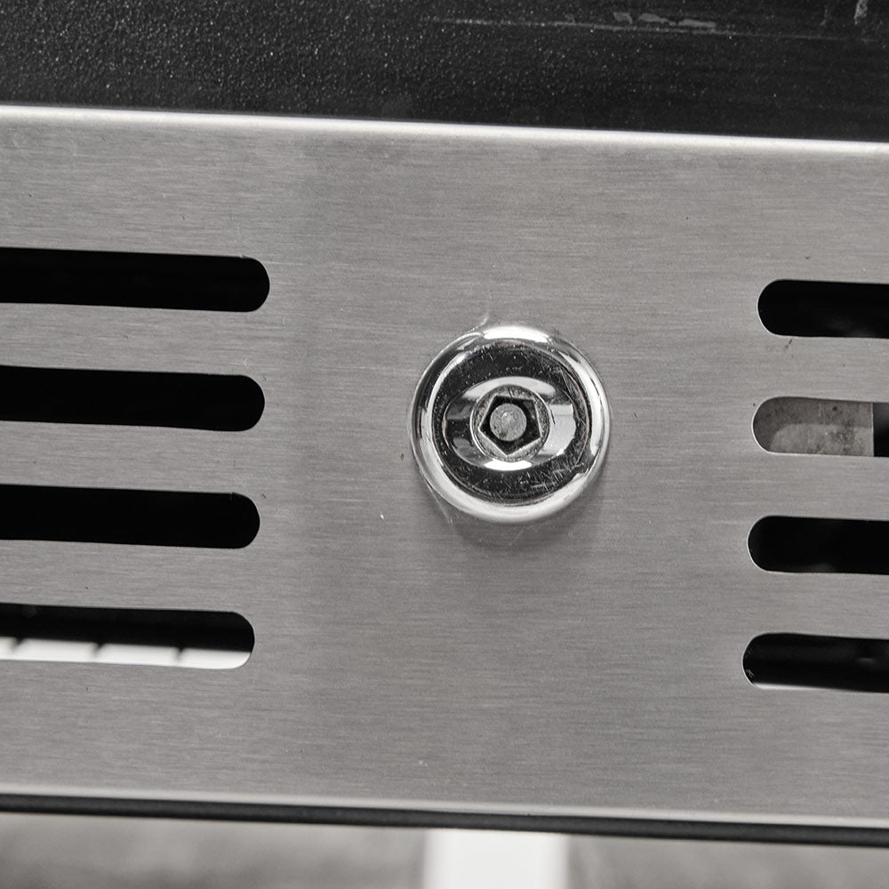 Stainless steel refrigerator vent panel with visible hex-head mounting screw
