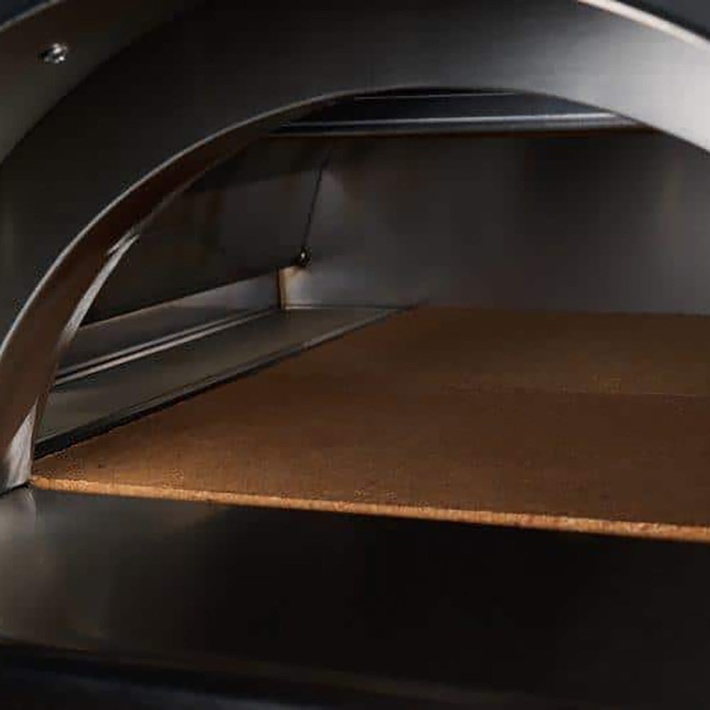 Pizza oven interior with arched opening and stone cooking floor