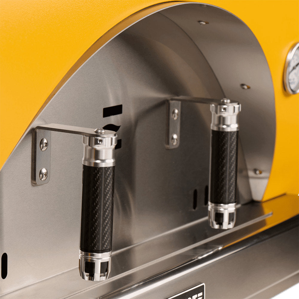 Pizza oven interior with stainless control levers and rods on the arched front