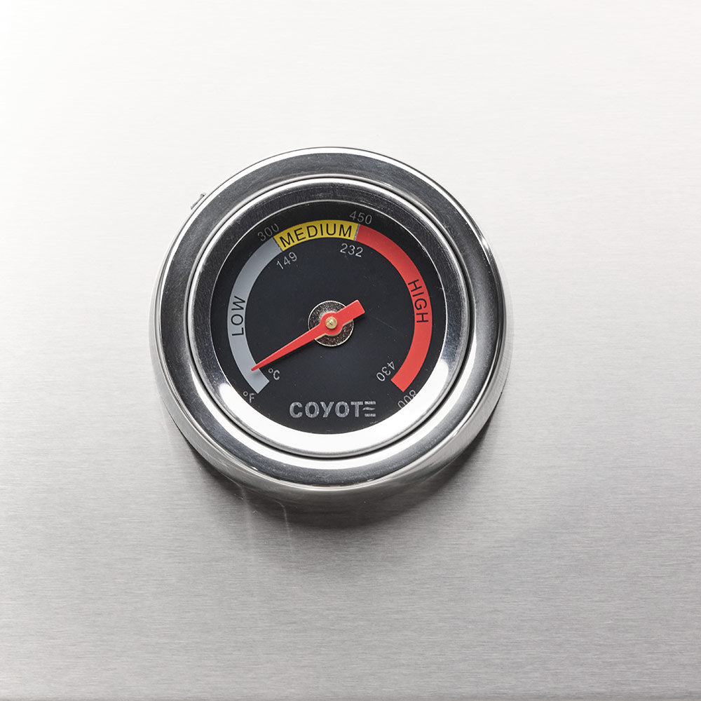 Analog grill temperature gauge with red and black heat range markings