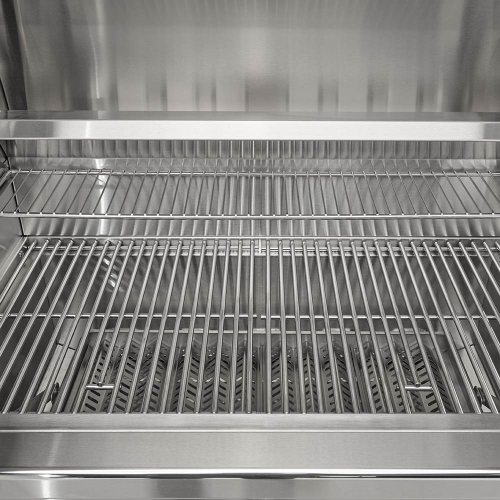 Charcoal grill cooking grates with stainless steel heat shield inside the firebox