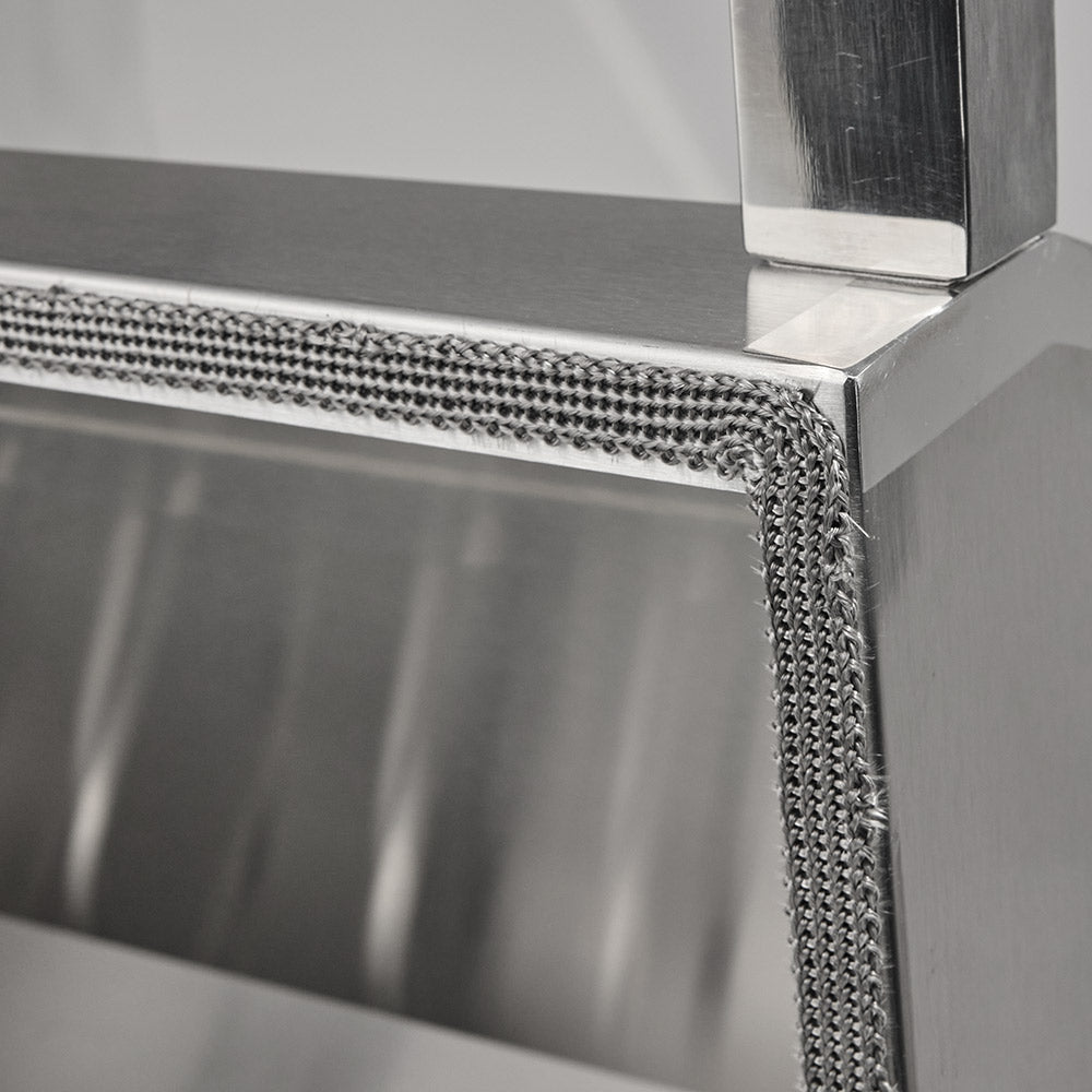 Stainless steel grill frame with woven door gasket along the edge