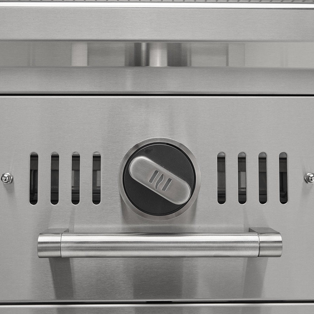 Charcoal grill control knob and front vent slots on stainless steel panel