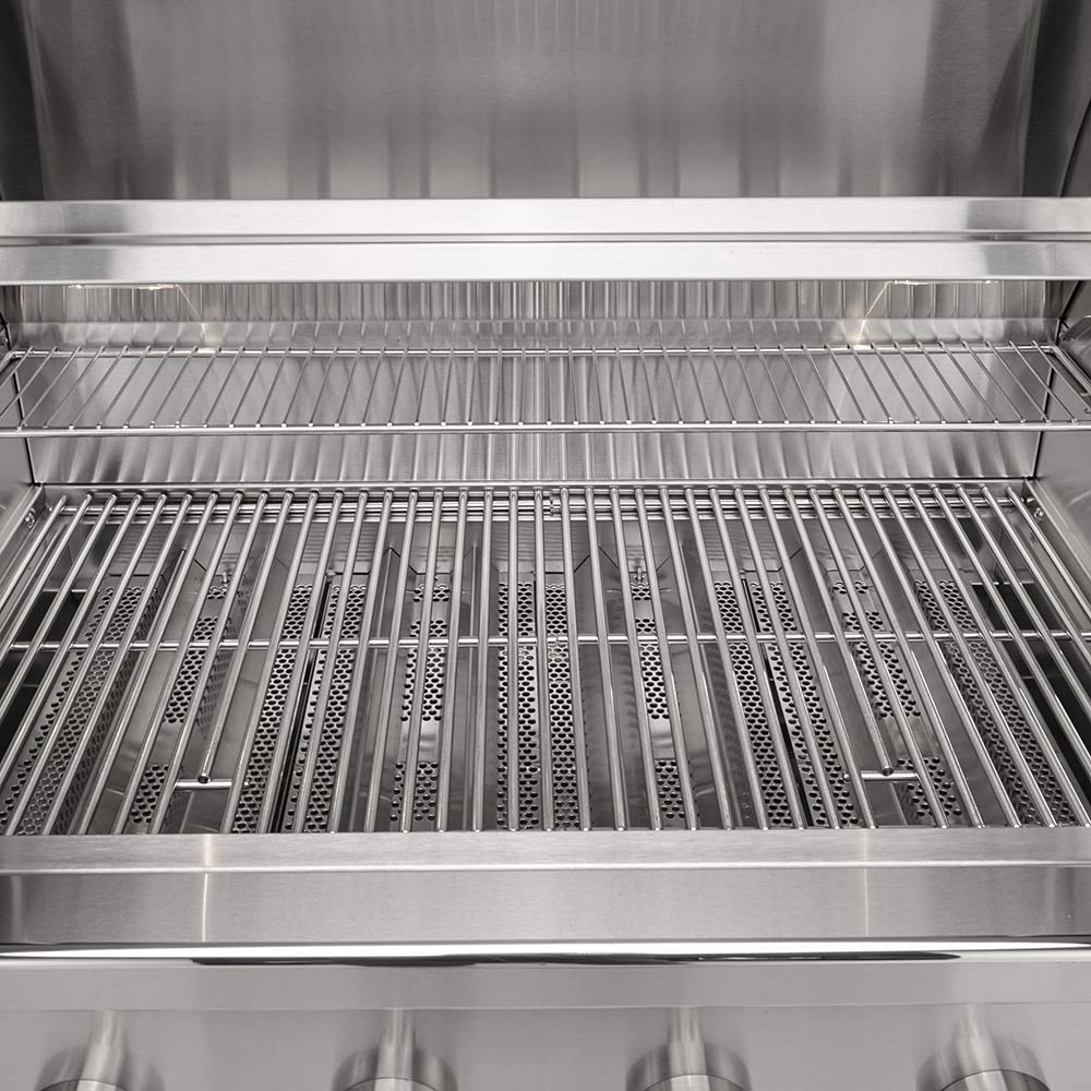 Gas grill cooking grates under open hood, with burner area below