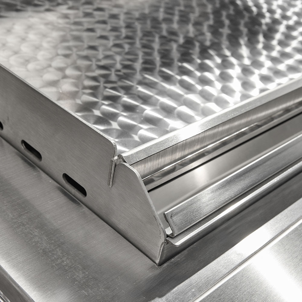 Textured stainless steel flat top griddle insert with raised pattern and side rails