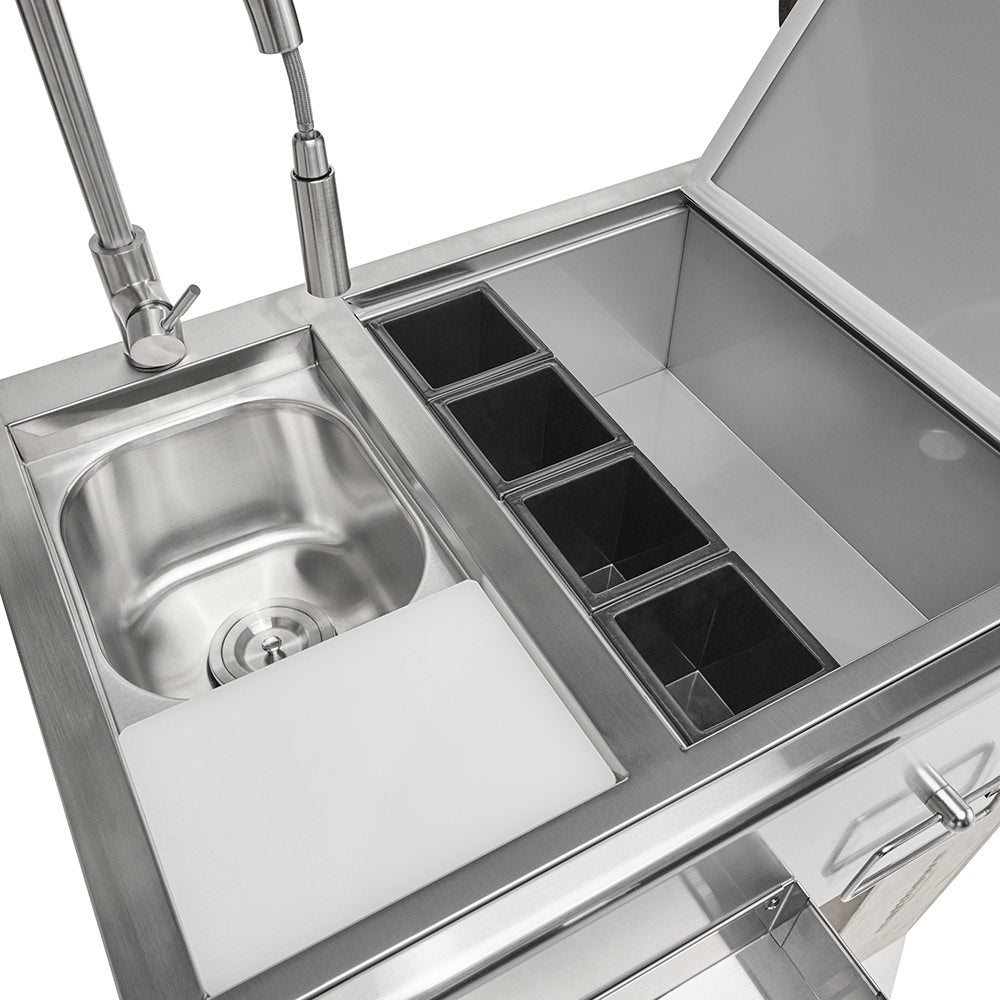 Stainless steel refreshment center interior with sink and four drink-chill wells