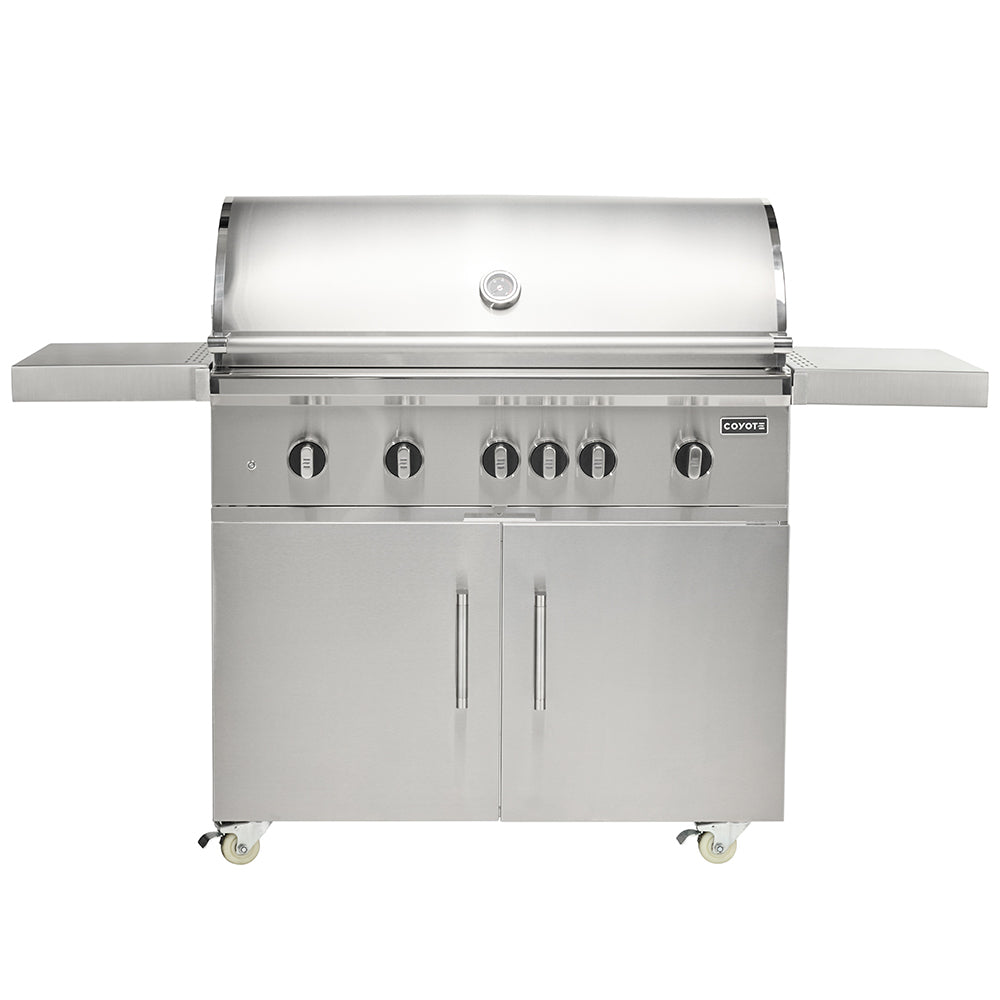 Stainless steel freestanding gas grill with four burners, front knobs, and side shelves.