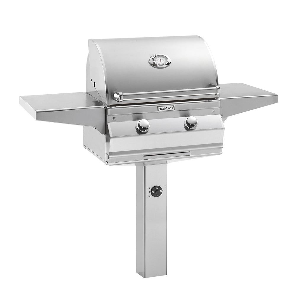 Stainless steel gas grill with lid, two control knobs, and side shelves on post mount