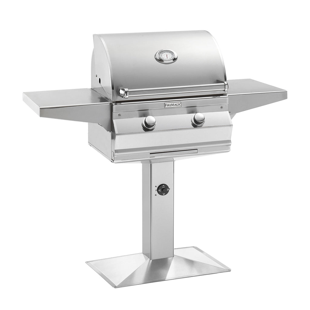 Multi-user stainless gas grill with lid, front knobs, and bolt-down post.