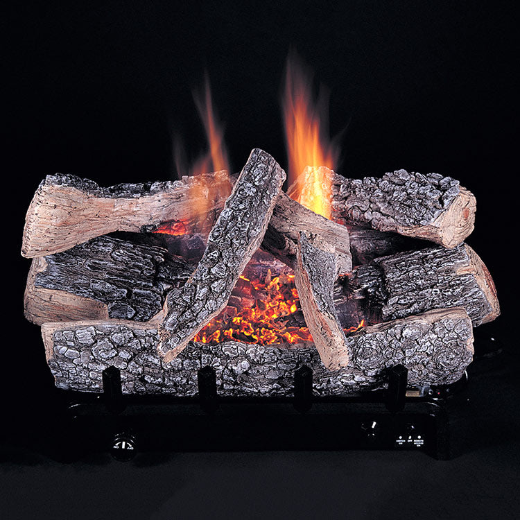 Gas log burner with textured ceramic logs and orange flames above an ember bed