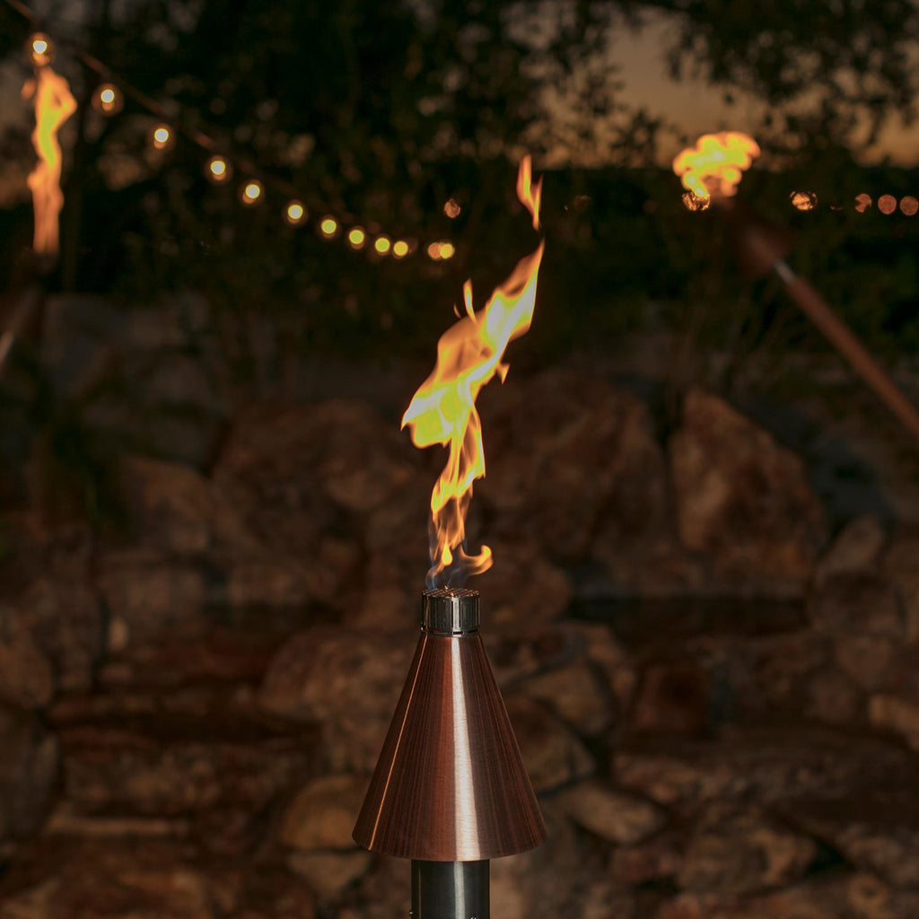 Copper cone gas torch head with active flame and silver base