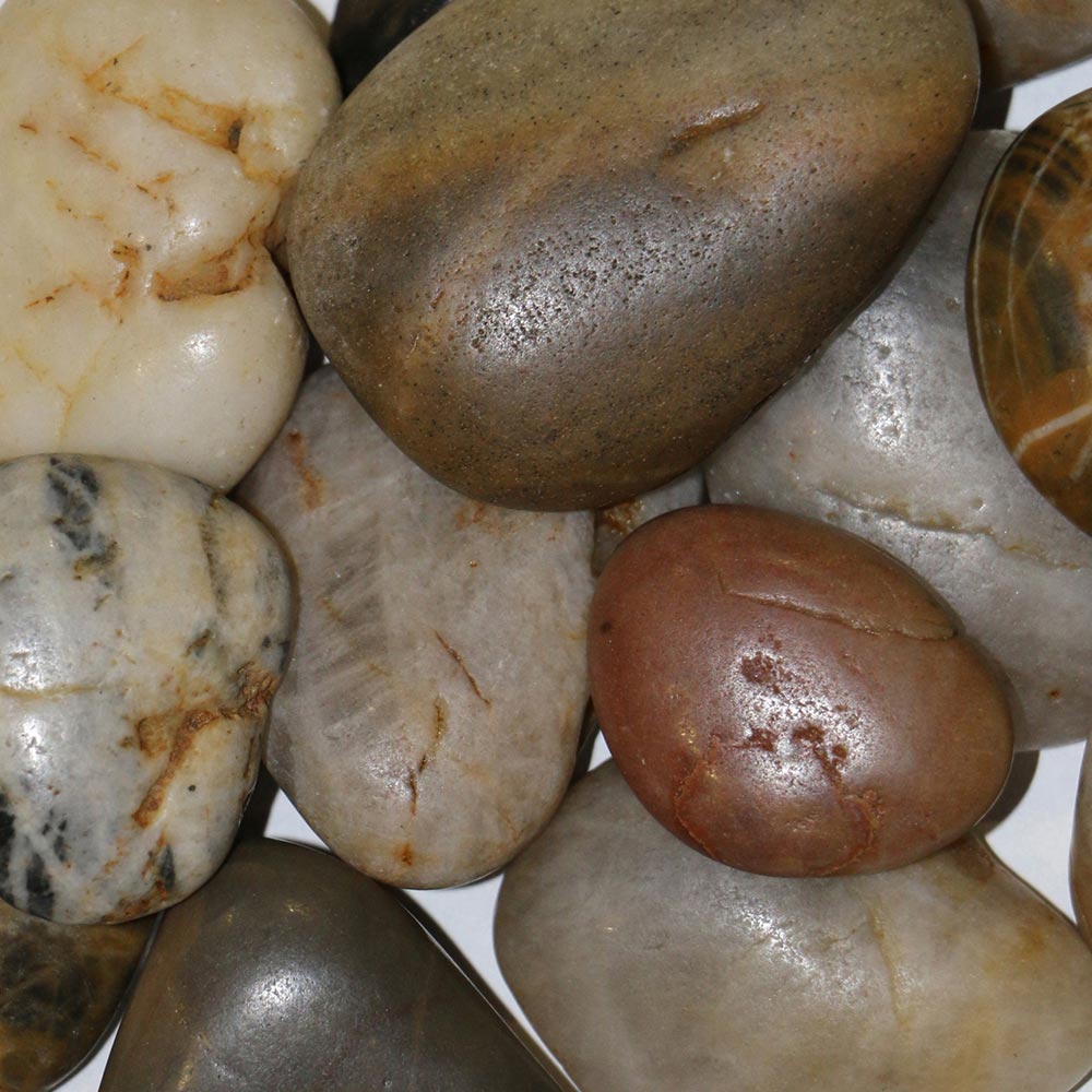 River rock media with smooth polished stones in dark, tan, and reddish brown