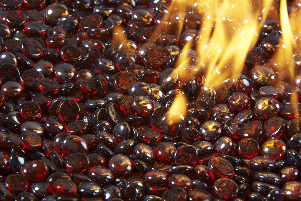 Ruby fire glass gems with a hand pouring more, glossy round beads