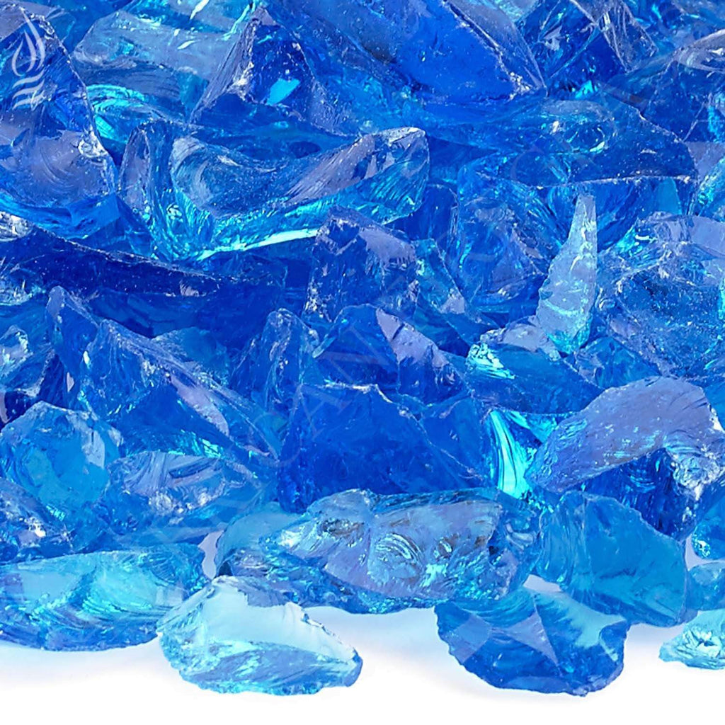 Close-up of turquoise recycled glass shards with faceted edges
