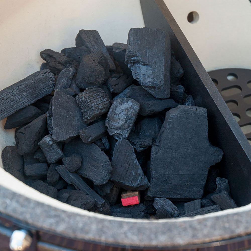 Black firestarter cubes in metal grill basket