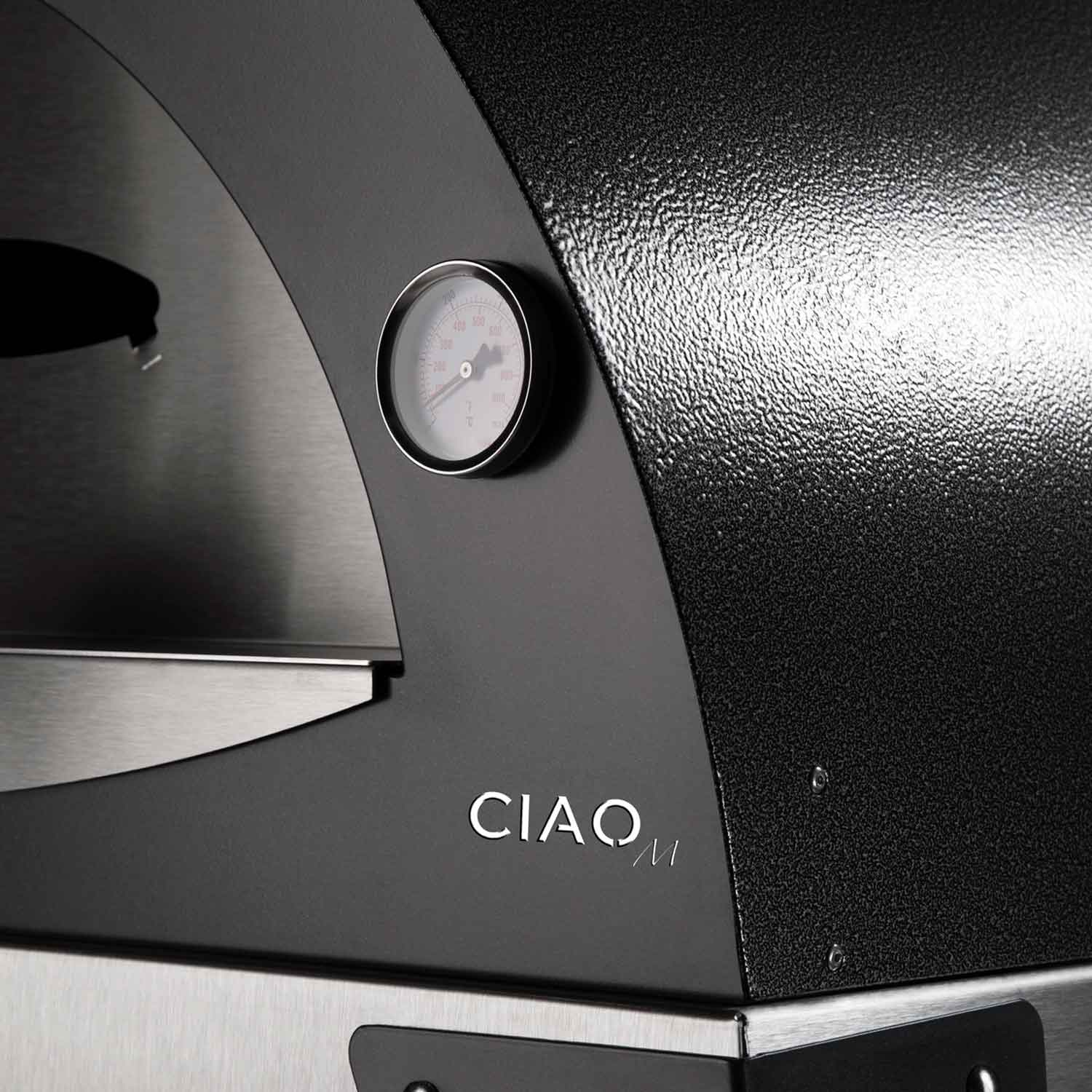 Pizza oven control gauge on black side panel with stainless front shelf