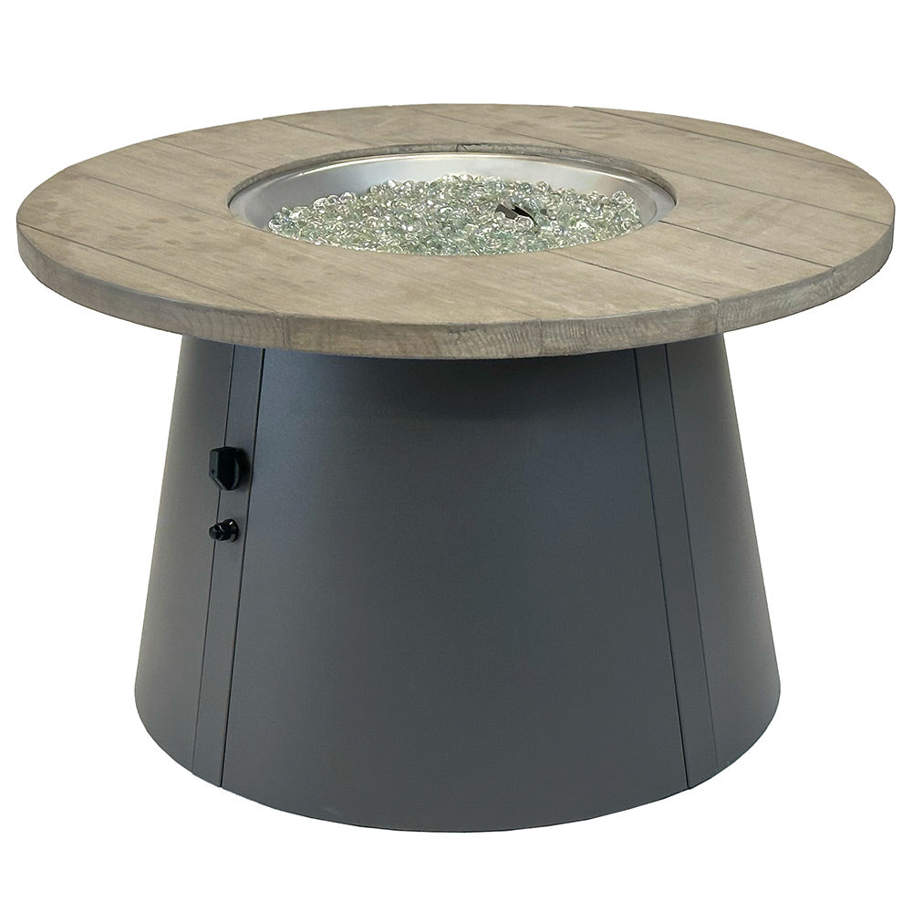 Round gas fire pit table with wood-look top and black base, unlit fire bowl with lava rocks