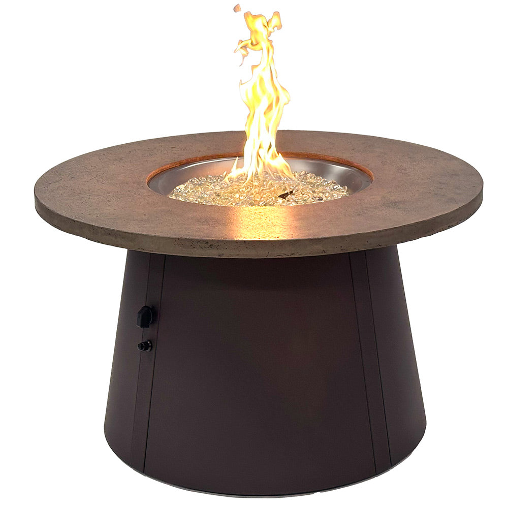 Round gas fire pit table with burning flames and dark base