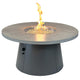 Round gas fire pit table with brown stone top and flame in center burner