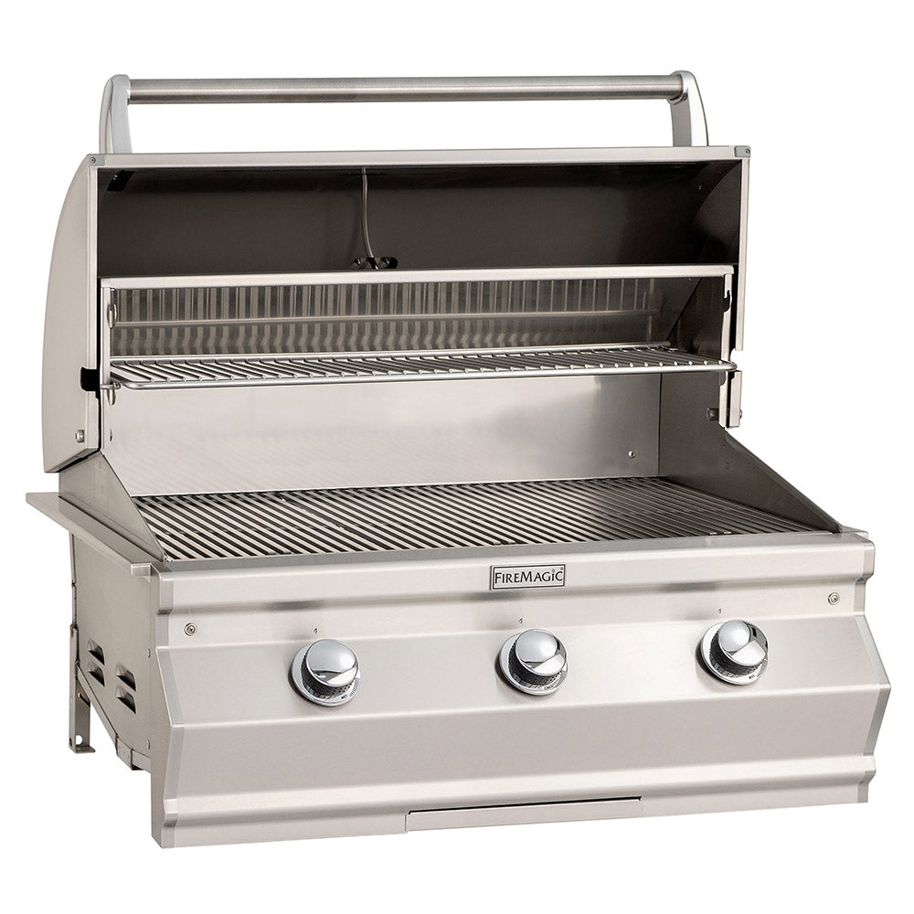 Open stainless steel built-in gas grill with cooking grates and warming area