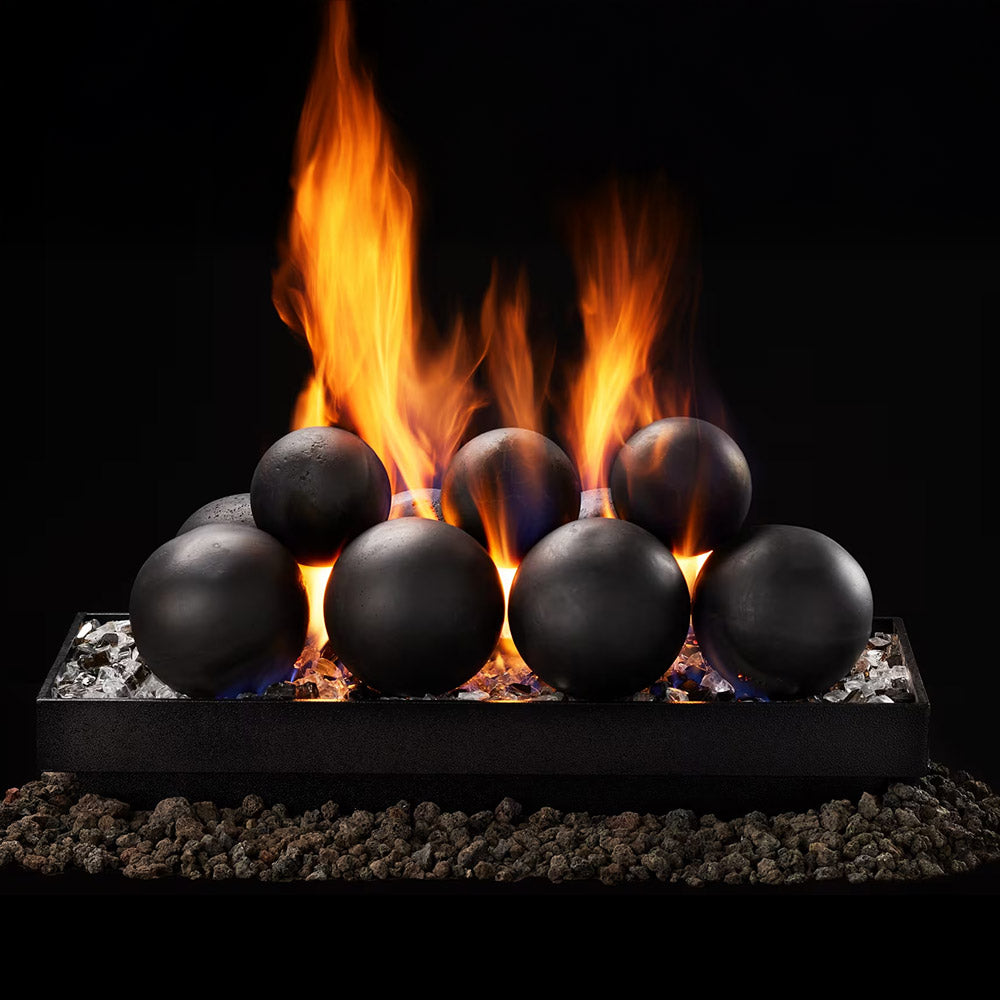 Indoor gas fire burner with dark cannonball media and orange flames