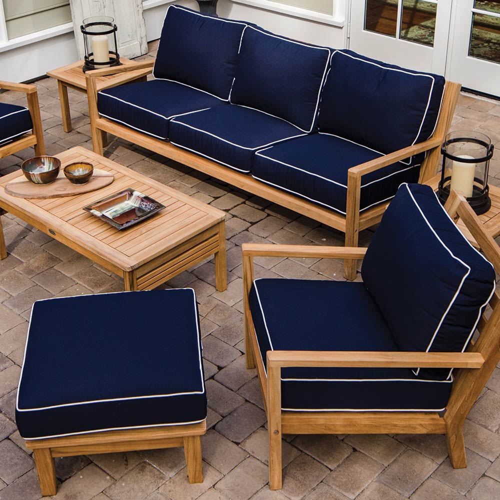 3-seater teak outdoor sofa with dark navy cushions and white piping