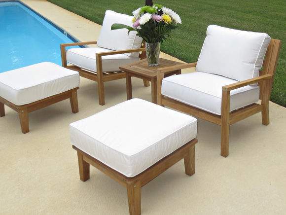 Teak patio seating set: two chairs with off-white cushions and a matching ottoman