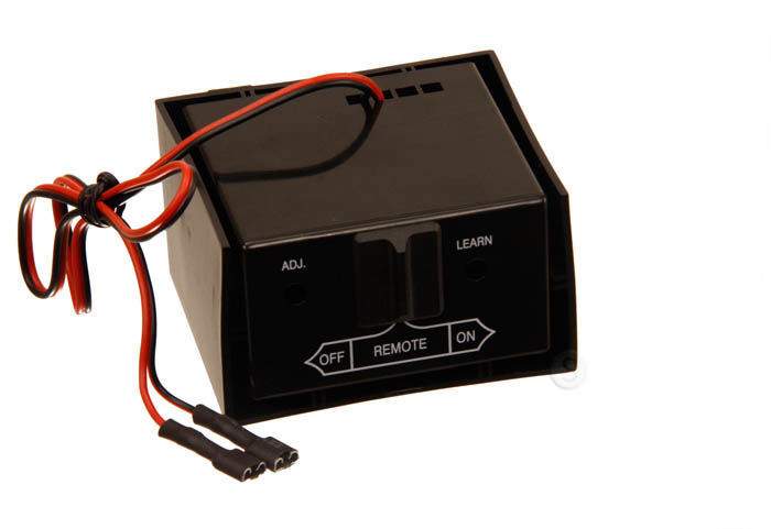 Black remote receiver module with ADJ. and LEARN switches and red wire harness