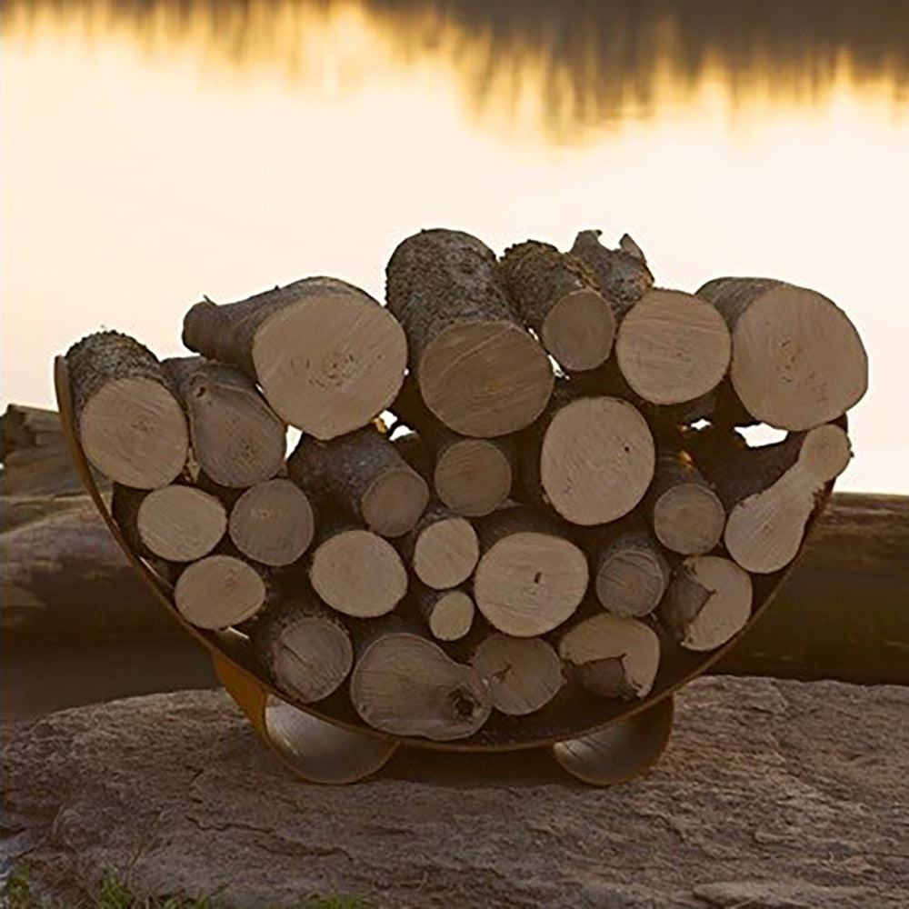 Crescent log rack holding stacked wood logs on a dark metal frame