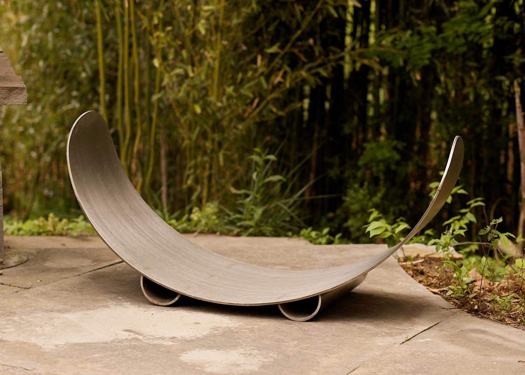 Stainless steel crescent log rack with curved cradle for firewood