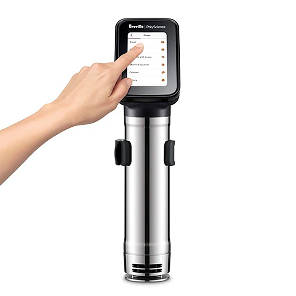Sous vide immersion circulator with touchscreen being tapped by a hand, stainless body