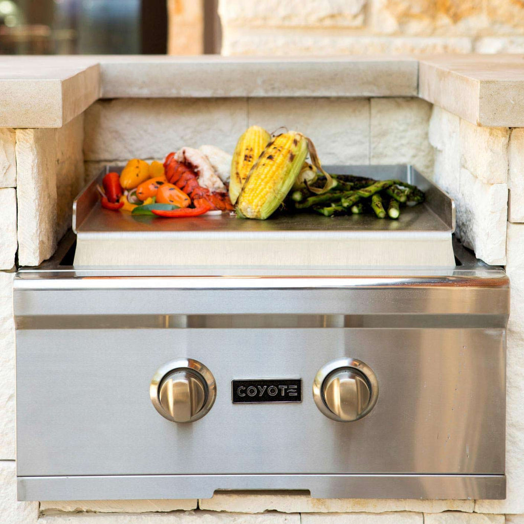 Coyote teppanyaki griddle on power burner with two control knobs