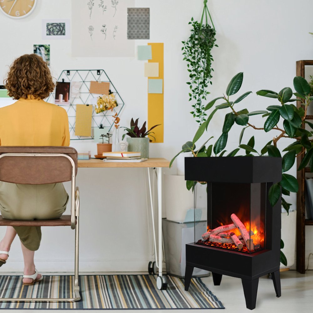 Black electric fireplace with glowing flames, on short legs, in a home corner