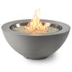Grey gas fire pit bowl close-up with flames and glass burner media