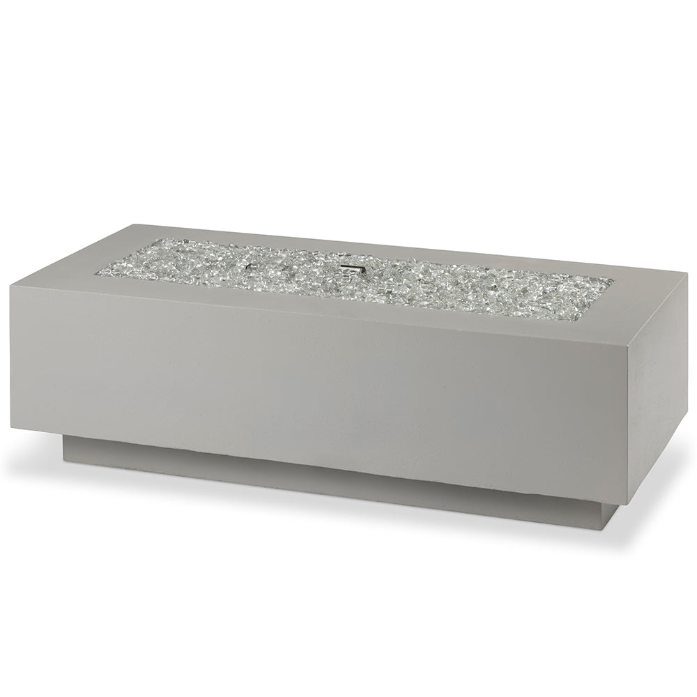 Linear gas fire pit table in light grey with decorative lava rocks, no flames