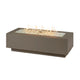 Linear gas fire pit table in taupe with flames and lava stones