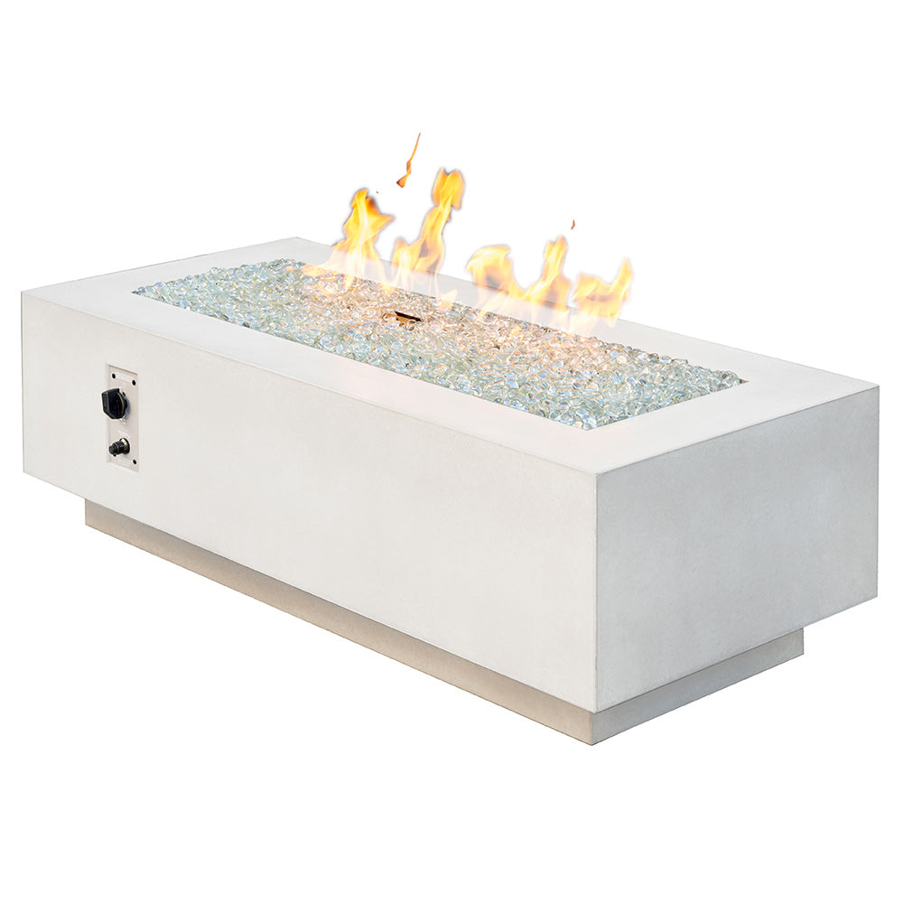 Linear gas fire pit table in white with flames, lava rocks, and control panel