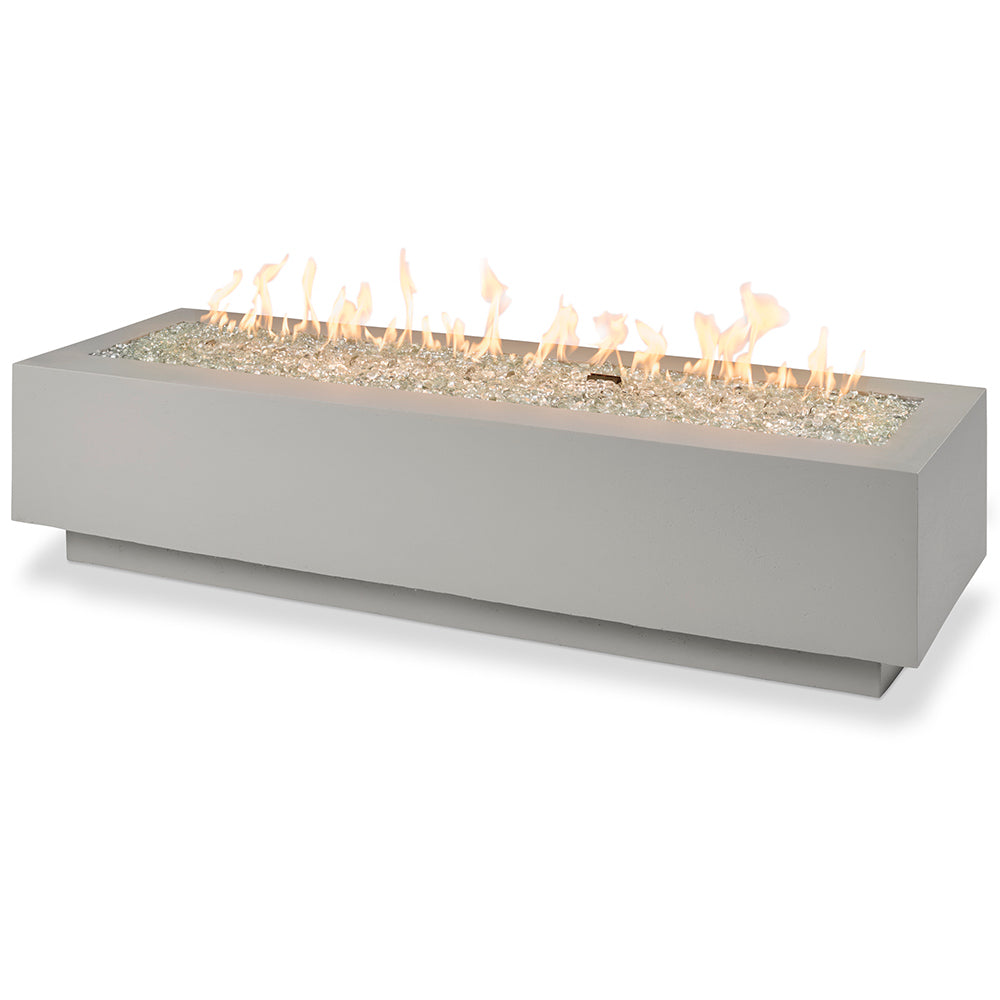 Linear gas fire pit table in white with glass fire bed and flames, rectangular shape