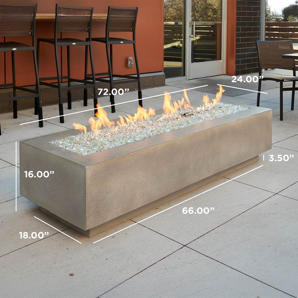 Linear gas fire pit table in earth stone with glass fire bed and flames, outdoor size view