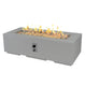 Light gray cove linear gas fire pit table with rectangular glass firebox and visible flames