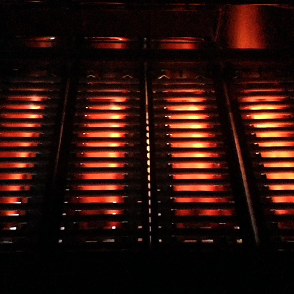 Ceramic heat tube heater with glowing orange heating elements
